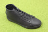 Clae Unisex Bradley Mid Sneaker - Triple Black Leather Side Angle View